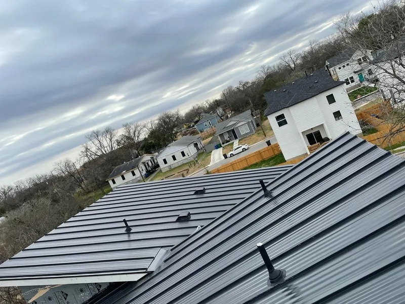 Standing seam metal roof panels with vents for Skylight Repair in Kansas City